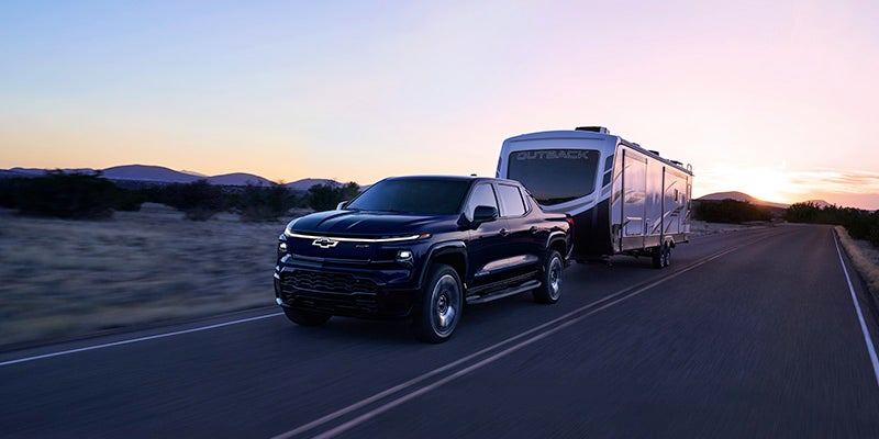 Image of EV Silverado pulling an RV